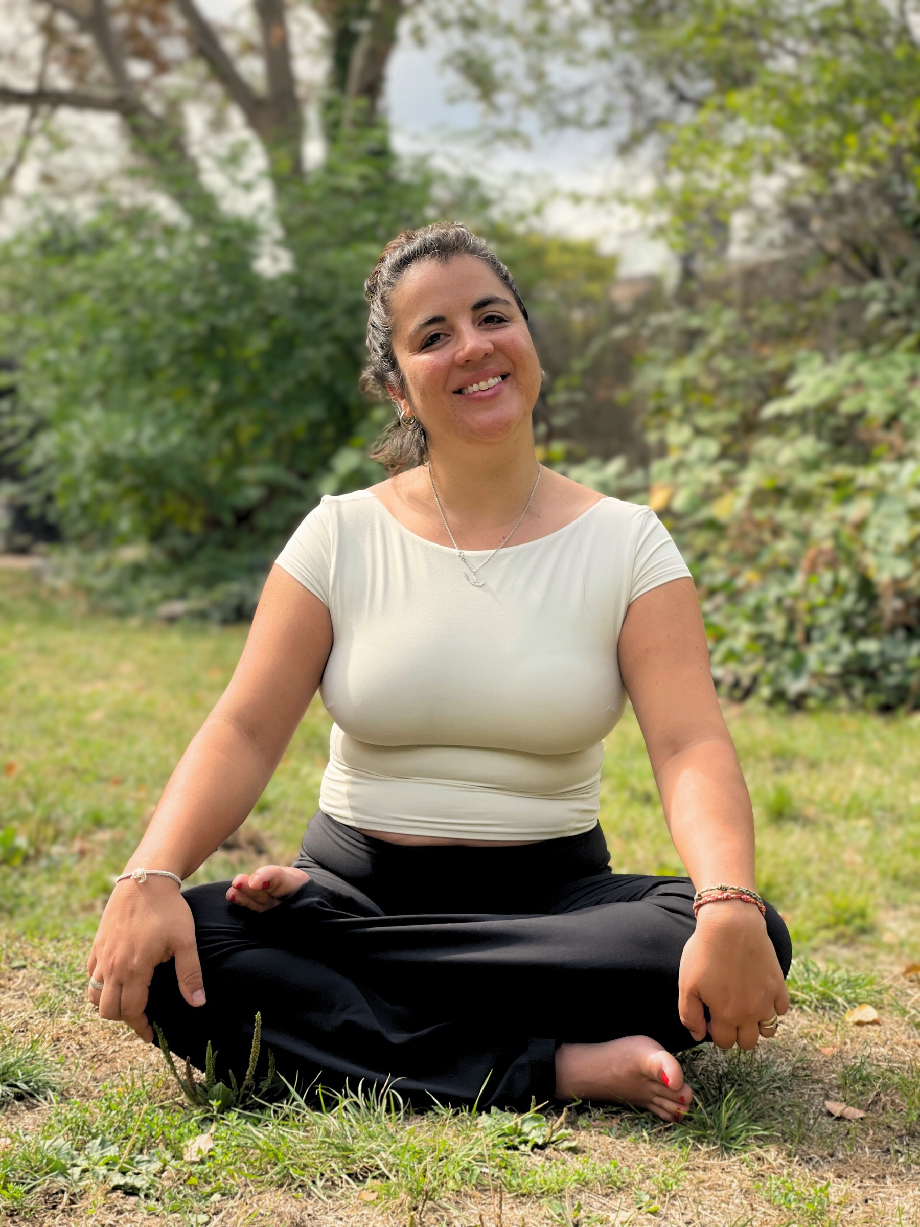 Maria Montserrat seated outdoors